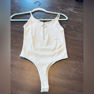 Beautiful mint color “one size” bodysuit.  I’d say it fits XS-Large.